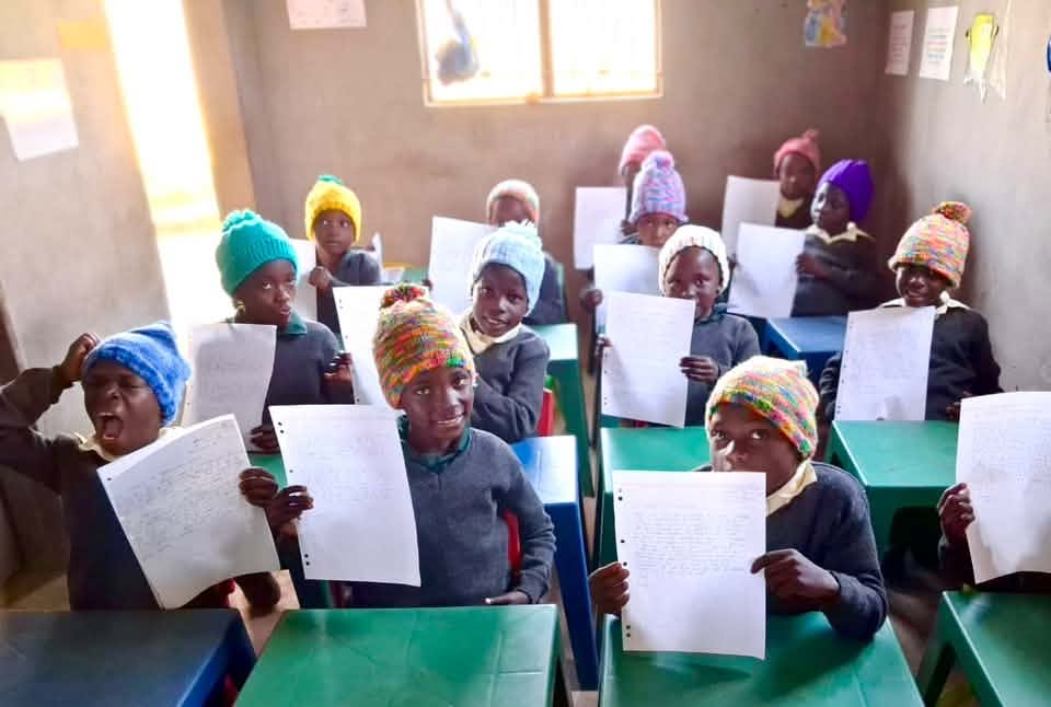 Students at Mamuke School proudly displaying some of the stationery donated by the St Joseph's community. Photo courtesy of Mamuke Acts of Hope Initiative. (2026)