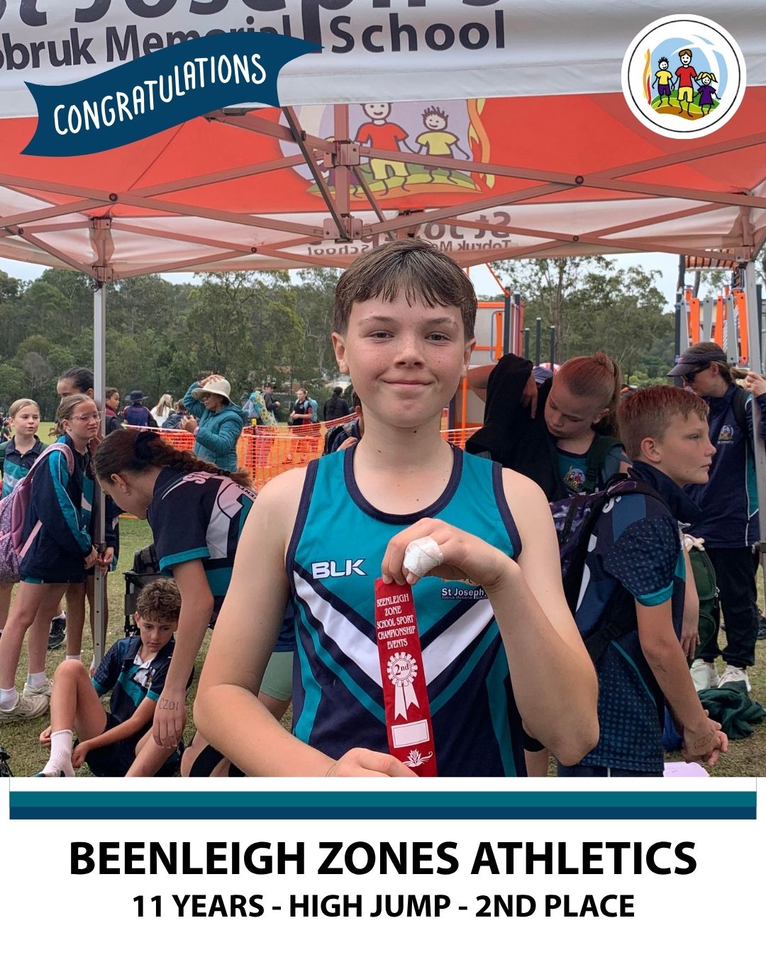 A child holding a 2nd place ribbon for High Jump