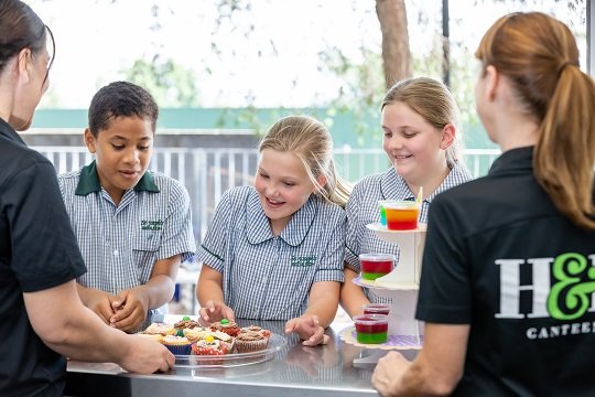 Photo of student's standing at tuckshop